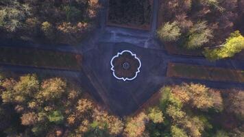 Beautiful quiet park. Clip. Drone view of a small park with walking roads and a fountain. video
