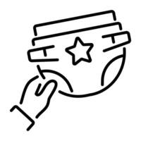 A line icon of a hand holding a diaper with a star on it vector