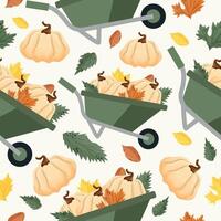 autumn seamless pattern with round pumpkins stacked in a wheelbarrow and various autumn leaves on a light background vector