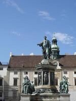 Vienna, Austria - 11 September 2024 Statue of Emperor Franz I in Inner Castle Square of Hofburg in Vienna photo