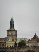Vienna, Austria - 11 September 2024 Main Bridge of Prague with clock tower, connecting the northern part of the city to the south in Eastern Europe photo