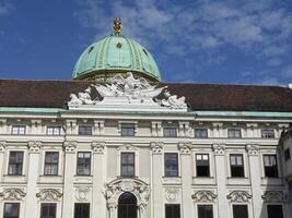 Vienna, Austria - 11 September 2024 featuring a corner section with a domed roof covered in greenish patina copper, typical of historical architecture in Austria, Belvedere Palace in Vienna photo