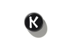 Minimalist black and white keyboard key 'k' isolated on white background with shadow photo