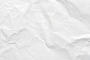 Crumpled white paper texture with natural creases and subtle shadows for backgrounds and design projects. photo