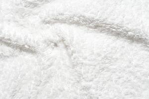 Soft white fleece texture with fluffy surface for cozy and comfortable backgrounds. photo