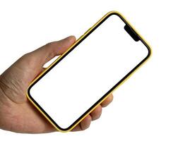 Hand holding smartphone in yellow case mockup with a white screen isolated on white background, mobile phone hand mockup photo