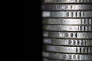 Stack of coins in close-up, texture of old coins photo