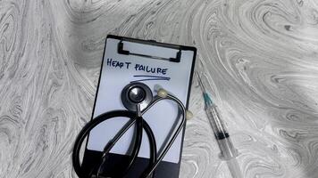 Concept of Heart Failure write on paperwork isolated on wooden background. photo