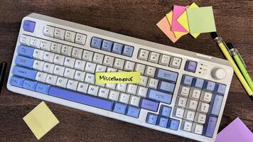 Concept of Miscellaneous write on sticky notes isolated on Wooden Table. photo
