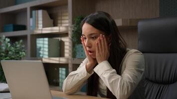 Caucasian business woman working on laptop feel stressed about system virus shocked girl businesswoman computer failure trouble important data loss outraged with website mistake malware loosing error photo