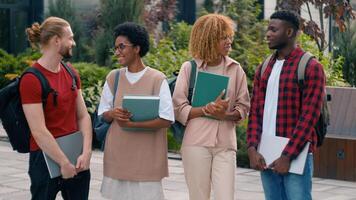 Diverse multiracial gen z friends happy smiling teens students pupils high school university college academy talking together laughing in city cuddling hugging conversation fun friendship education photo