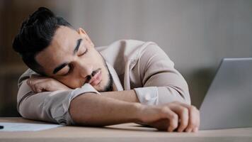 Sleepy unproductive man office male worker businessman falling asleep at office desk tired multiracial student closed eyes feeling exhausted after routine tasks hard computer work overworked concept photo