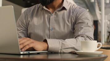 Close-up unrecognizable man guy typing on laptop businessman freelancer programmer working remote on internet using computer application in cafe make order in online store send email to social network photo