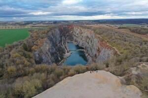 A view of a canyon with a lake in the middle photo