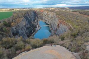 A view of a canyon with a lake in the middle photo