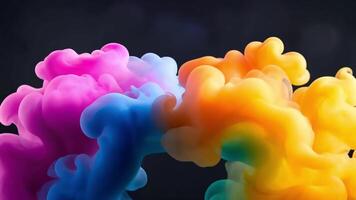 Abstract colorful paint clouds on black background. video