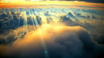 aérien vue de une lever du soleil plus de une champ de duveteux des nuages, le du soleil des rayons brillant à travers. video