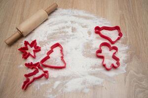 Cookie cutters for Christmas cookies on the wooden table. Christmass card and advent calendar concept.Top view.. High quality photo