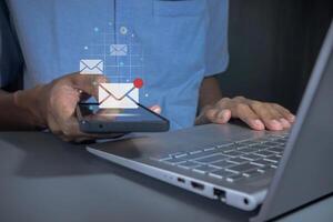 Man holding a mobile phone with email notification, new message or social media notification photo