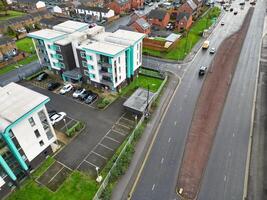 Aerial View of Manchester City During Autumn Season and Cloudy Day over England Great Britain. High Angle Drone's Camera Footage was Captured on October 29th, 2024 photo