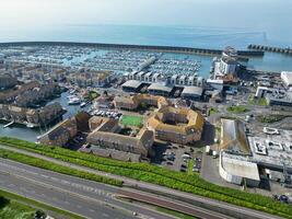 High Angle View of Most Beautiful and Attractive British Tourist Attraction of Brighton seaside resort and Beach City of East Sussex, England GB. Footage Captured with Drone's Camera on May 9th, 2024 photo