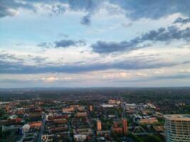Aerial View of Greater Manchester City Centre and Tall Buildings During Golden Hour of Sunset. England UK. High Angle Footage Was Captured with Drone's Camera During Windy day of May 5th, 2024 photo