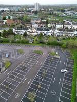 high Angle View of Buildings at Central Borehamwood London City of England United Kingdom. April 4th, 2024, Aerial View Was Captured with Drone's Camera From High altitude During Cloudy and Windy Day. photo