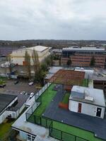 high Angle View of Buildings at Central Borehamwood London City of England United Kingdom. April 4th, 2024, Aerial View Was Captured with Drone's Camera From High altitude During Cloudy and Windy Day. photo