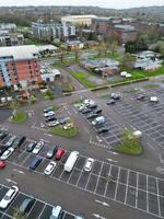 high Angle View of Buildings at Central Borehamwood London City of England United Kingdom. April 4th, 2024, Aerial View Was Captured with Drone's Camera From High altitude During Cloudy and Windy Day. photo