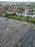 high Angle View of Buildings at Central Borehamwood London City of England United Kingdom. April 4th, 2024, Aerial View Was Captured with Drone's Camera From High altitude During Cloudy and Windy Day. photo