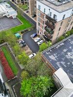 high Angle View of Buildings at Central Borehamwood London City of England United Kingdom. April 4th, 2024, Aerial View Was Captured with Drone's Camera From High altitude During Cloudy and Windy Day. photo