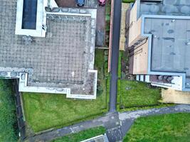 high Angle View of Buildings at Central Borehamwood London City of England United Kingdom. April 4th, 2024, Aerial View Was Captured with Drone's Camera From High altitude During Cloudy and Windy Day. photo