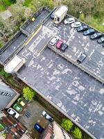 high Angle View of Buildings at Central Borehamwood London City of England United Kingdom. April 4th, 2024, Aerial View Was Captured with Drone's Camera From High altitude During Cloudy and Windy Day. photo