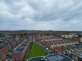 high Angle View of Buildings at Central Borehamwood London City of England United Kingdom. April 4th, 2024, Aerial View Was Captured with Drone's Camera From High altitude During Cloudy and Windy Day. photo