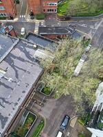 high Angle View of Buildings at Central Borehamwood London City of England United Kingdom. April 4th, 2024, Aerial View Was Captured with Drone's Camera From High altitude During Cloudy and Windy Day. photo