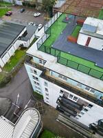 high Angle View of Buildings at Central Borehamwood London City of England United Kingdom. April 4th, 2024, Aerial View Was Captured with Drone's Camera From High altitude During Cloudy and Windy Day. photo