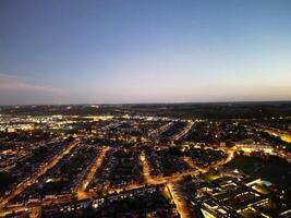 Most Beautiful High Angle View of Illuminated Luton City of England UK at Just After Sunset and Full Moon Night. Aerial Footage Was Captured with Drone's Camera on October 17th, 2024 photo