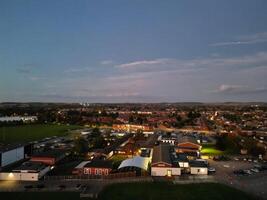 Most Beautiful High Angle View of Illuminated Luton City of England UK at Just After Sunset and Full Moon Night. Aerial Footage Was Captured with Drone's Camera on October 17th, 2024 photo
