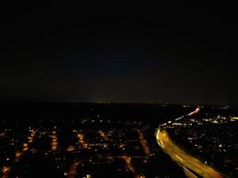 Most Beautiful High Angle View of Illuminated Luton City of England UK at Just After Sunset and Full Moon Night. Aerial Footage Was Captured with Drone's Camera on October 17th, 2024 photo