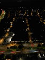 Most Beautiful High Angle View of Illuminated Luton City of England UK at Just After Sunset and Full Moon Night. Aerial Footage Was Captured with Drone's Camera on October 17th, 2024 photo