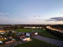 Most Beautiful High Angle View of Illuminated Luton City of England UK at Just After Sunset and Full Moon Night. Aerial Footage Was Captured with Drone's Camera on October 17th, 2024 photo