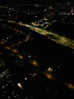 Most Beautiful High Angle View of Illuminated Luton City of England UK at Just After Sunset and Full Moon Night. Aerial Footage Was Captured with Drone's Camera on October 17th, 2024 photo