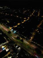 Most Beautiful High Angle View of Illuminated Luton City of England UK at Just After Sunset and Full Moon Night. Aerial Footage Was Captured with Drone's Camera on October 17th, 2024 photo
