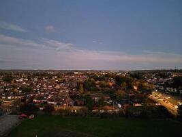 Most Beautiful High Angle View of Illuminated Luton City of England UK at Just After Sunset and Full Moon Night. Aerial Footage Was Captured with Drone's Camera on October 17th, 2024 photo
