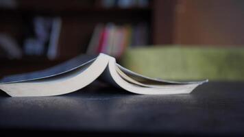 An Open Book on a Table in a Cozy Reading Space filled with warmth and creativity video