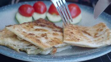Savor this delicious flatbread topped with fresh cherry tomatoes and a refreshing salad video