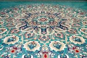 Detail of color and geometric shapes on a carpet photo