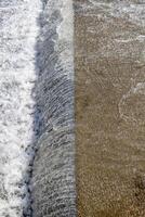 water falling from cascade edge of concrete water spillway channel photo