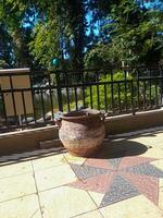 a trash can made of tires placed in a city park. the concept of maintaining environmental cleanliness photo