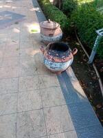 a trash can made of tires placed in a city park. the concept of maintaining environmental cleanliness photo